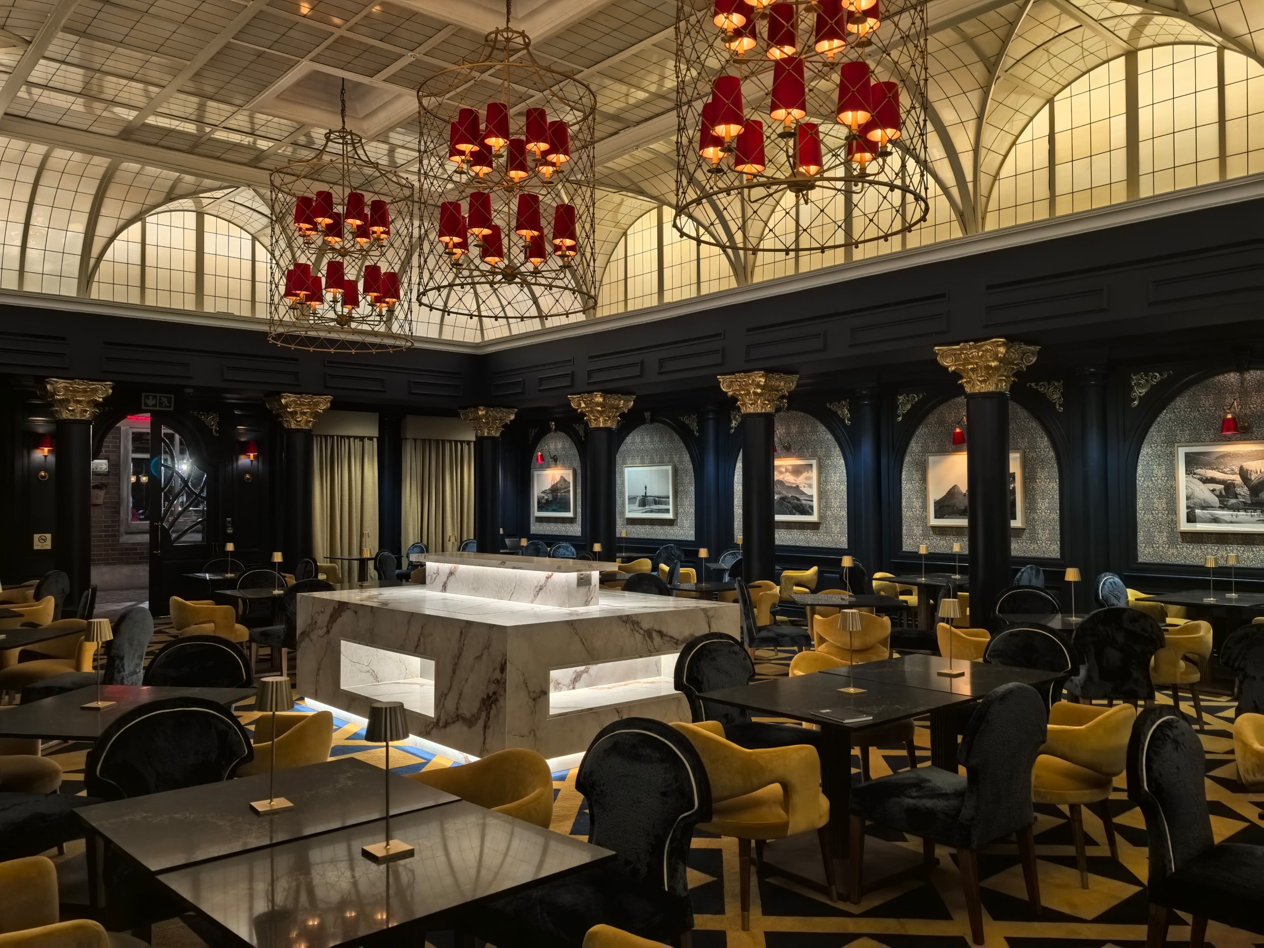 Grey and yellow suede chairs in dining hall